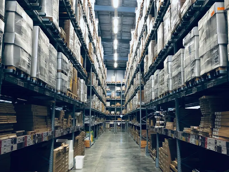 Long aisles of stocked shelves in a warehouse